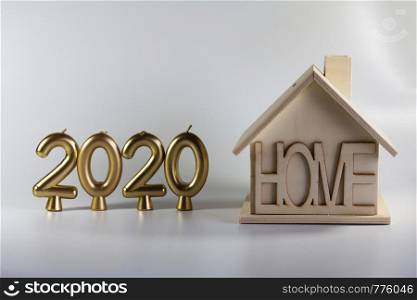 2020 year of candles and a homemade wooden house. Illustration for postcards and new year.. 2020 year of candles and a homemade wooden house.