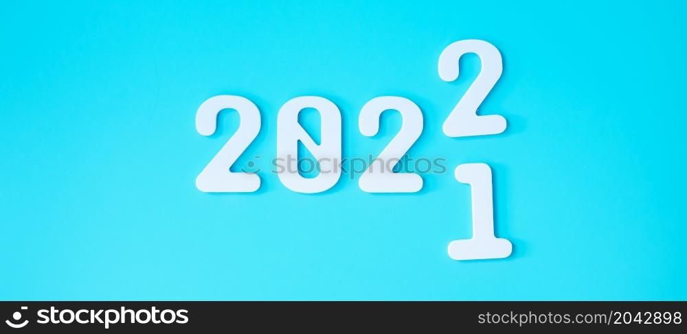 2021 change to 2022 number on blue background. Plan, finance, Resolution, strategy, solution, goal, business and New Year holiday concepts