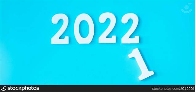 2021 change to 2022 number on blue background. Plan, finance, Resolution, strategy, solution, goal, business and New Year holiday concepts