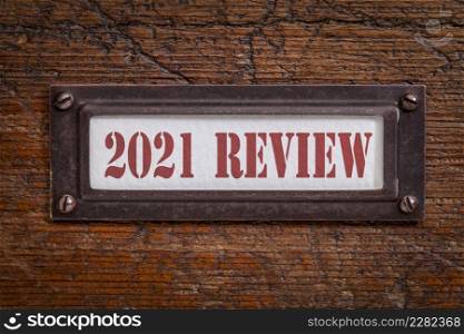 2021 review - a label on grunge wooden file cabinet. A passing year evaluation, summary and review concept.