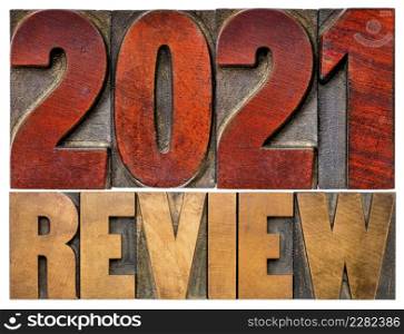 2021 review banner - annual review or summary of the recent year - isolated word abstract in letterpress wood type blocks, business and financial concept