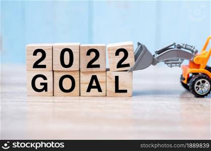 2022 goal cube blocks with miniature truck or construction vehicle. New Start, Vision, Resolution, goal, industrial, Warehouse and happy New Year concept