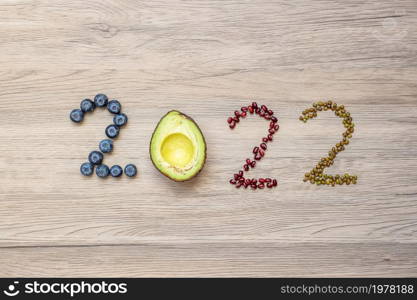 2022 Happy New Year and New You with fruit and vegetable; Blueberries, Avocado and Bean on table. Goals, Healthy, Motivation, Resolution, Time to New Start, dieting and world food day concept