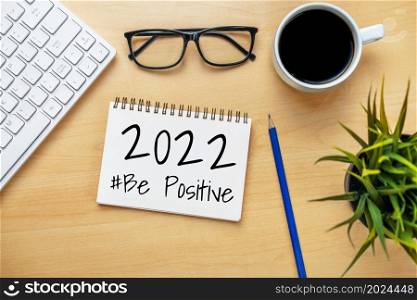 2022 Happy New Year Resolution Goal List and Plans Setting - Business office desk with notebook written about plan listing of new year goals and resolutions setting. Change and determination concept.. 2022 Happy New Year Resolution Goal List and Plans Setting