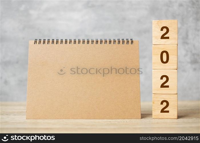 2022 Happy New Year with blank notebook and wooden number. countdown, Resolution, Goals, Plan, Action and Mission Concept