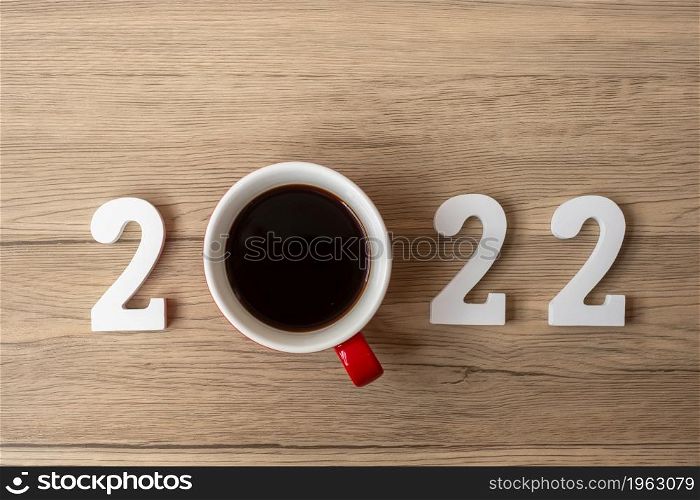 2022 Happy New Year with coffee cup and Christmas decoration on wood table background. New Start, Resolution, countdown, Goals, Plan, Action and Mission Concept