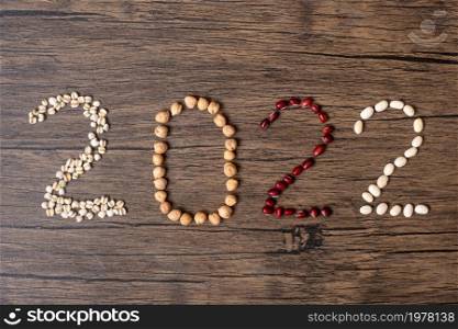 2022 New Year and New You with organic Beans; red,, white,, chickpeas and Adlay on table. Goals, Healthy, Motivation, Resolution, Weight loss, dieting and world food day concept