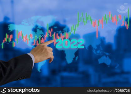 2022 New year candlestick graph chart auto trade, business finance investment stock exchange market concept background.