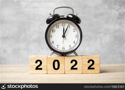 2022 text with clock on table. Resolution, time, plan, goal, motivation, reboot, countdown and New Year holiday concepts