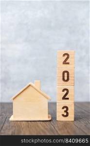 2023 block with house model. real estate, Home loan, tax, investment, financial, savings and New Year Resolution concepts