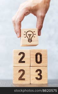 2023 block with lightbulb icon. Business Idea, Creative, Thinking, brainstorm, Goal, Resolution, strategy, plan, Action, change and New Year start concepts