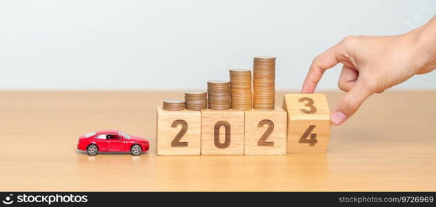 2023 flipping to 2024 year block with car model and Coins Money stack for deposit and Automobile Tax. Money Saving, Car Insurance, Financial, vehicle Repair and Maintenance and New Year concept