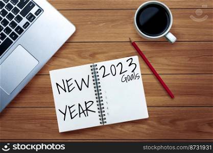 2023 Happy New Year Resolution Goal List and Plans Setting - Business office desk with notebook written about plan listing of new year goals and resolutions setting. Change and determination concept.. 2023 Happy New Year Resolution Goal List and Plans Setting