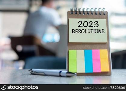 2023 Resolution word on note paper with pen on wooden table. strategy, solution, goal, business, New Year New You and happy holiday concepts
