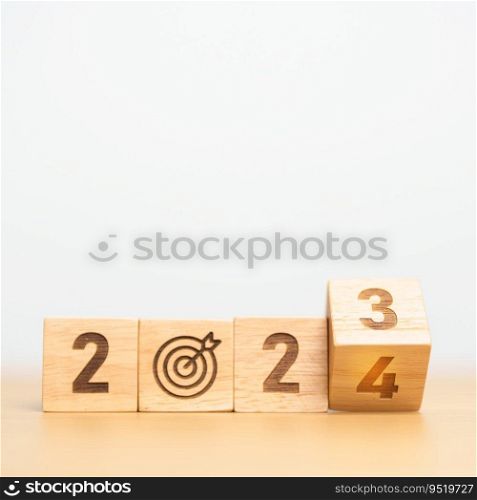 2023 year change to 2024 year block with dartboard icon. Goal, Target, Resolution, strategy, plan, Action, mission, motivation, and New Year start concepts