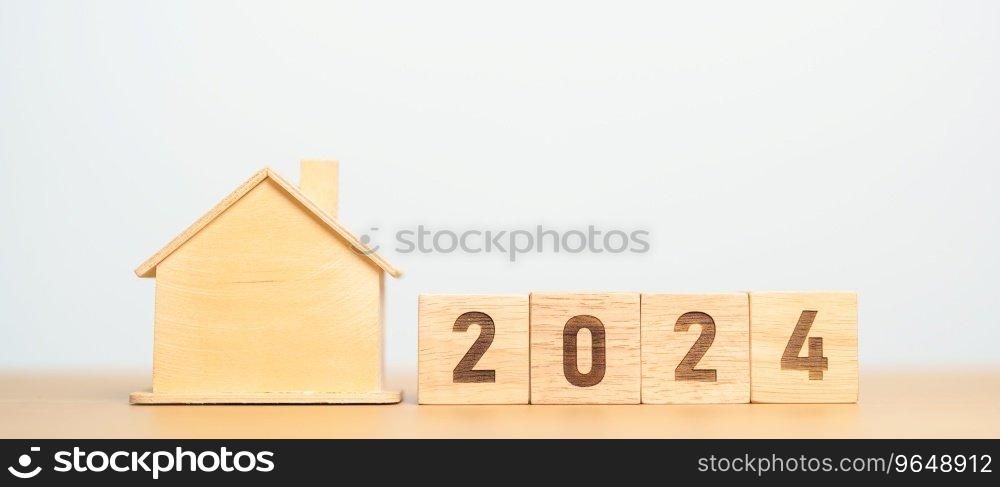 2024 block with house model. real estate, Home loan, tax, investment, financial, savings and New Year Resolution concepts