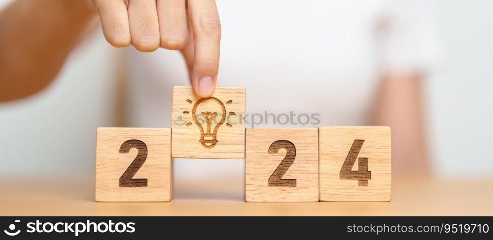 2024 block with lightbulb. Business Idea, Creative, Thinking, brainstorm, Goal, Resolution, strategy, plan, Action, change and New Year start concepts