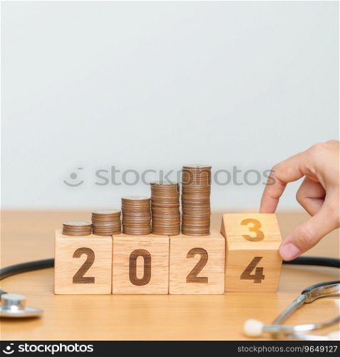 2024 Happy New Year for health care with doctor Stethoscope on table. Money saving, Goal, Resolution, health Insurance, Wellness and medical concept