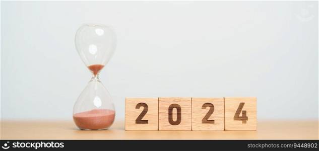 2024 text with hourglass on table. Resolution, time, plan, goal, motivation, reboot, countdown  and New Year holiday concepts