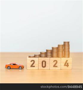 2024 year block with car model and Coins Money stack for deposit and Automobile Tax. Money Saving, Car Insurance, Financial, vehicle Repair and Maintenance and New Year concept
