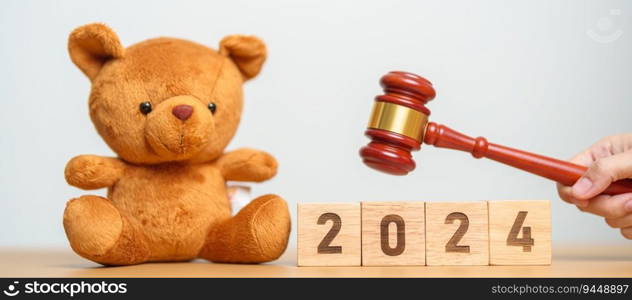 2024 year block with toy bear with gavel justice hammer. Children, Kid, Family Law and Happy New year concepts