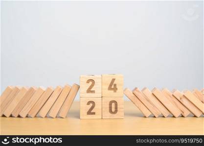 2024 year with falling blocks on table, Risk Management, recession, business financial, Resolution, strategy, goal, New Year planning and inflation economy concepts