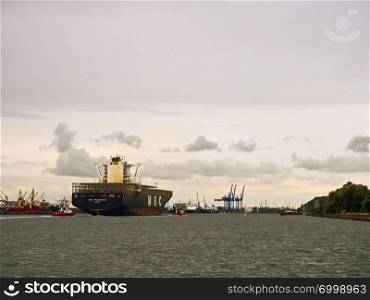 24 June 2018, Baltic sea, Klaipeda, Lithuania, port, canal, empty container ship, cargo ship with escort. cargo ship with escort, empty container ship