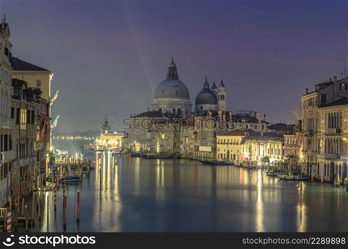 28 November 2015 Venice, italy, Canal grande with historical houses, gondole traditional boats and st may of health Basilica in background. venice the most beautiful city in the world