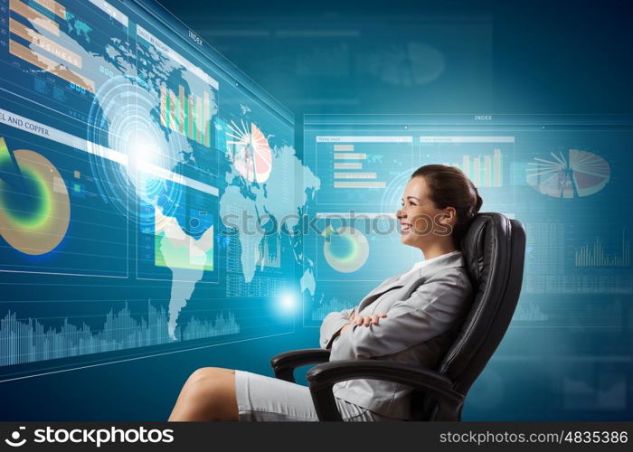 3 d technologies. Young businesswoman in chair near tv screen