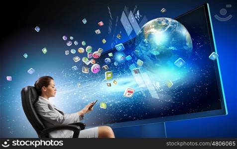 3 d technologies. Young businesswoman in chair near tv screen with click. Elements of this image are furnished by NASA