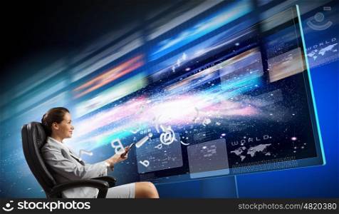 3 d technologies. Young businesswoman in chair near tv screen with click