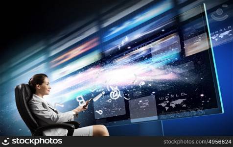 3 d technologies. Young businesswoman in chair near tv screen with click
