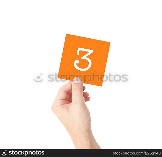 3 written on a card held by a hand