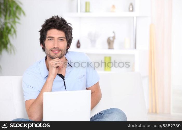30 years old man with laptop at home
