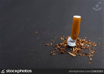 31 May of World No Tobacco Day, no smoking, close up of broken pile pin down cigarette or tobacco on black background with copy space, and Warning lung health concept