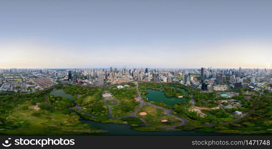 360 panorama by 180 degrees angle seamless panorama of aerial of green trees in Lumpini Park, Sathorn, Bangkok Downtown Skyline. Thailand. Financial district in urban city. Skyscraper buildings.