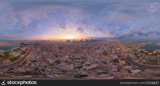 360 panorama by 180 degrees angle seamless panorama of aerial view of Dubai Downtown skyline and highway, United Arab Emirates or UAE. Financial district in urban city. Skyscraper buildings at sunset.