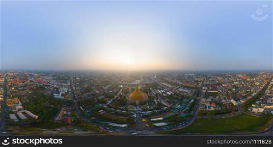 360 panorama by 180 degrees angle seamless panorama view of aerial top view of Phra Pathommachedi temple at sunset. The golden buddhist pagoda, urban city of Nakorn Pathom, Thailand. Thai architecture