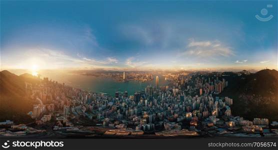 360 panorama by 180 degrees angle seamless panorama view of Downtown Hong Kong City at sunset. Skybox as background in equirectangular spherical equidistant projection for VR content