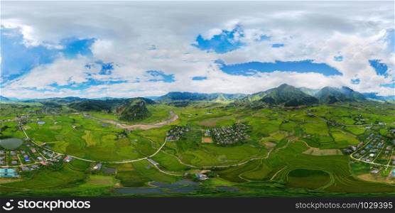 360 panorama by 180 degrees angle seamless panorama view of Fansipan mountain with paddy rice terraces, green agricultural fields in rural area, hills valley, Vietnam. Nature landscape background.