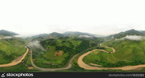 360 panorama by 180 degrees angle seamless panorama view of paddy rice terraces, green agricultural fields in rural area of Mu Cang Chai, mountain hills valley in Vietnam. Nature landscape background.