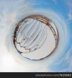 360 spherical panorama of aerial shot of bridge and car driving on the bridge, winter sunny day in Barnaul, Siberia, Russia. 360 spherical panorama of Barnaul