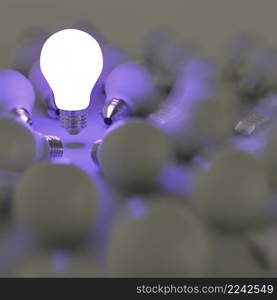 3d growing light bulb standing out from the unlit incandescent bulbs as leadership concept