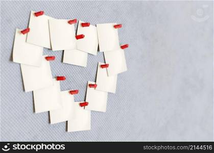 3d illustration. Blank note paper making shape of heart pinned cork board. space for text
