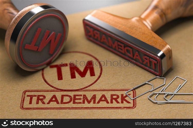 3D illustration of two rubber stamps with the word trademark and the symbol TM over brown paper background. Trade-mark Registration Concept. Trademark Registration Concept