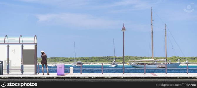 3d illustration, woman waiting for the bus in mallorca