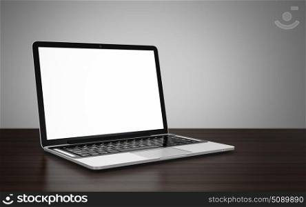 3D image of modern laptop with blank screen on wooden table next to gray wall