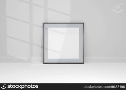3d Mockup black frame photo on wall with shadows.