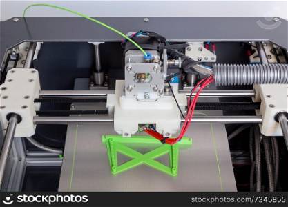 3d printer with bright green filament.. 3d printer with bright green filament