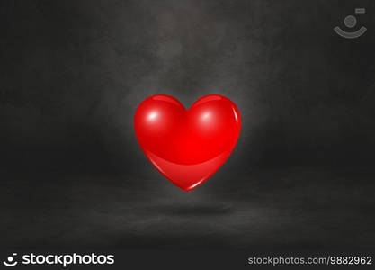 3D red heart isolated on a black studio background. 3D illustration. 3D red heart on a black studio background